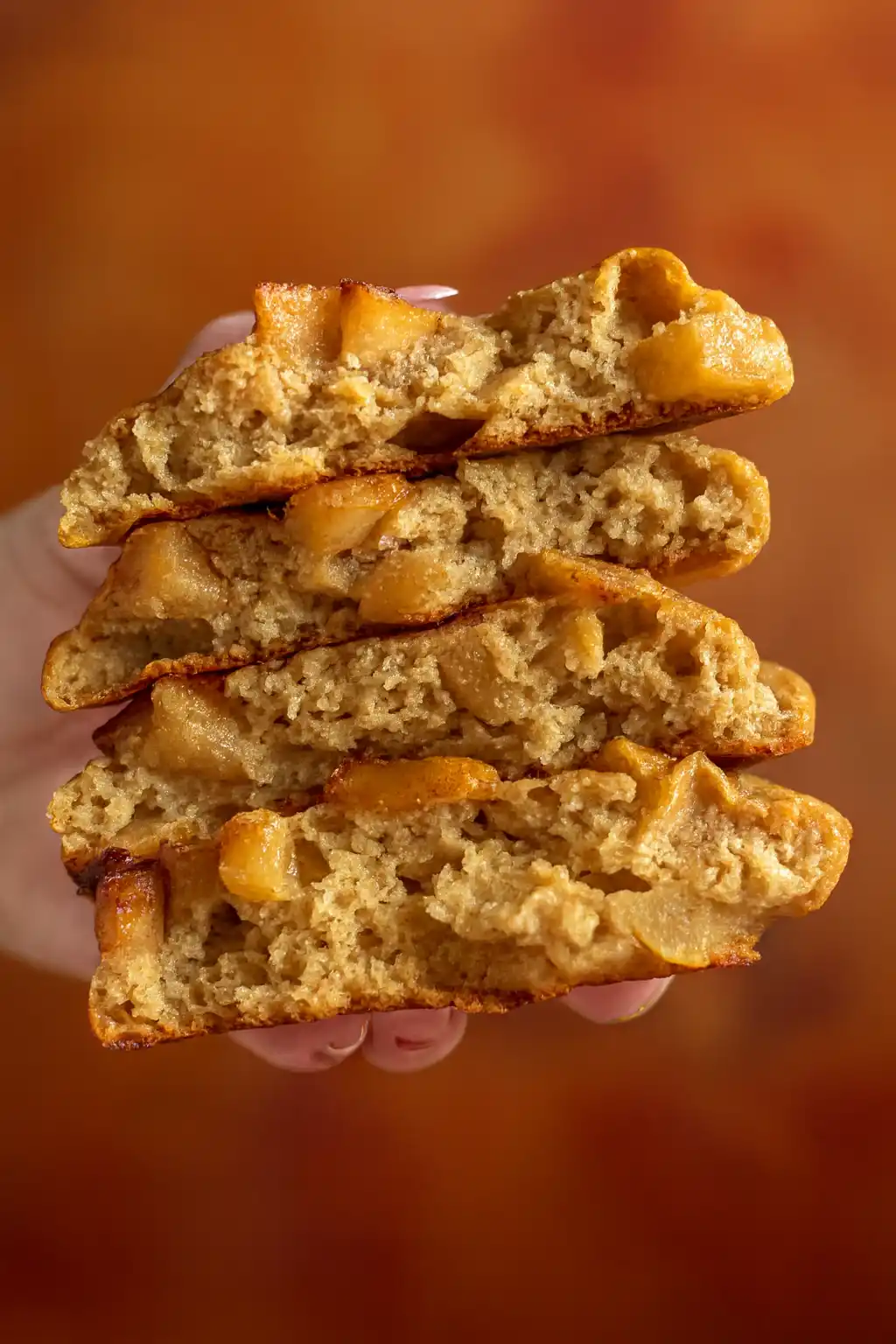 mixing dough for apple biscuit breakfast recipe with apple pie filling and cottage cheese in a large bowl