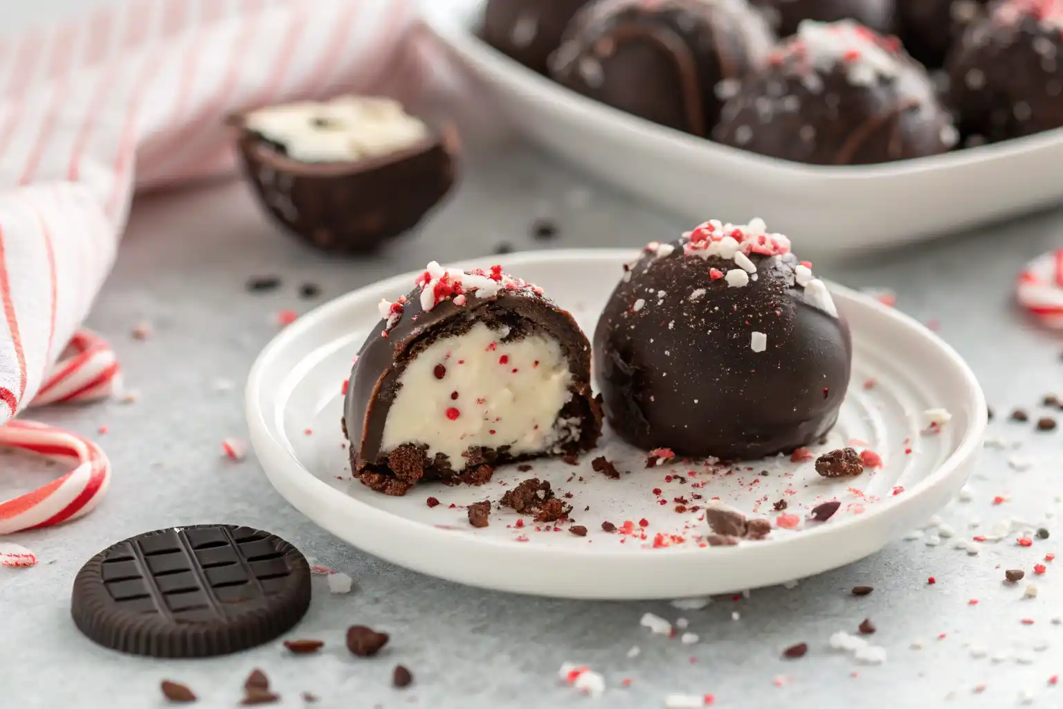 Mixing crushed Oreos with cream cheese and peppermint extract to make Oreo cookie balls